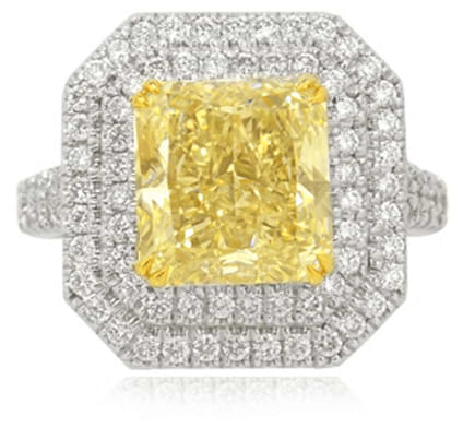 6.45Ct TW Fancy Light Yellow Radiant Diamond Double Halo Ring set in 18K white gold.